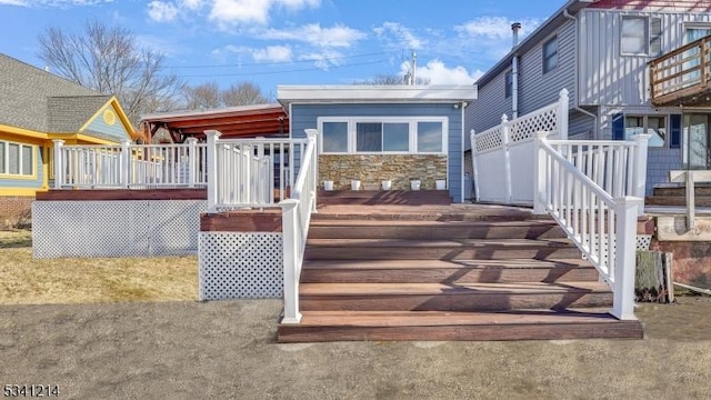 wooden deck featuring stairway