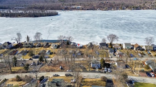 birds eye view of property with a water view and a residential view