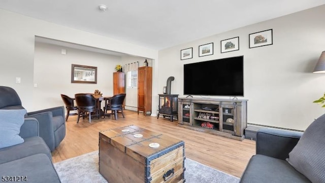 living room featuring a baseboard radiator and wood finished floors