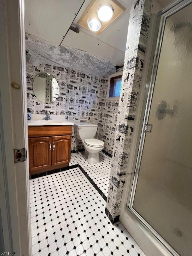 full bathroom with toilet, a stall shower, and vanity