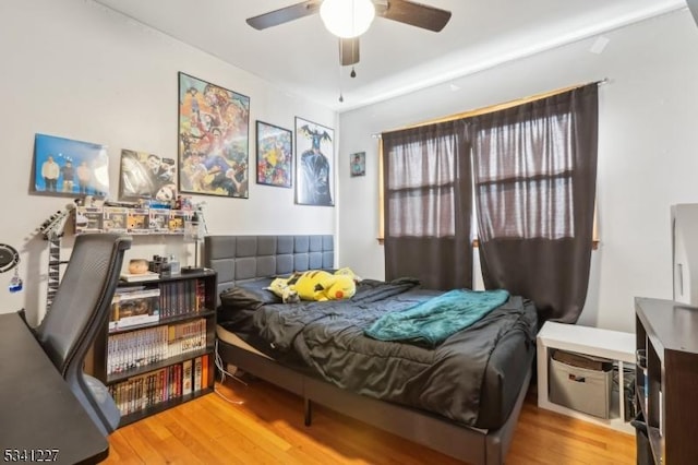 bedroom featuring ceiling fan and wood finished floors