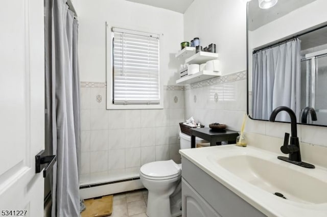 full bath featuring toilet, vanity, a shower with curtain, baseboard heating, and tile patterned floors