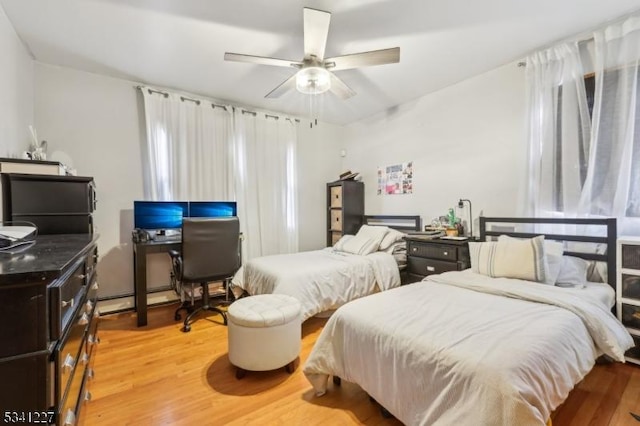 bedroom with a ceiling fan and light wood finished floors