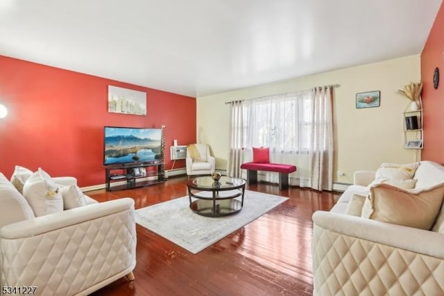 living area with a wall mounted AC, a baseboard radiator, and wood finished floors