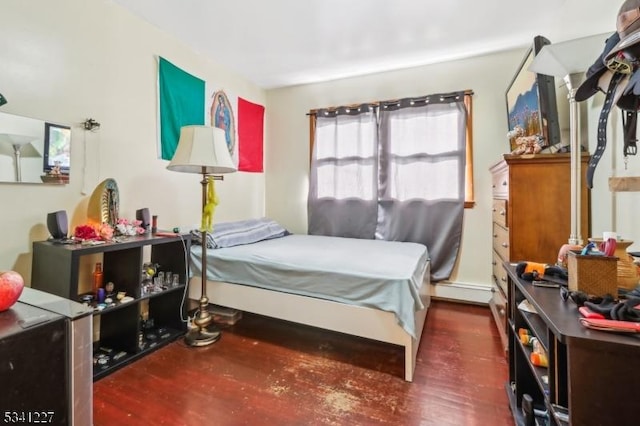 bedroom featuring wood finished floors