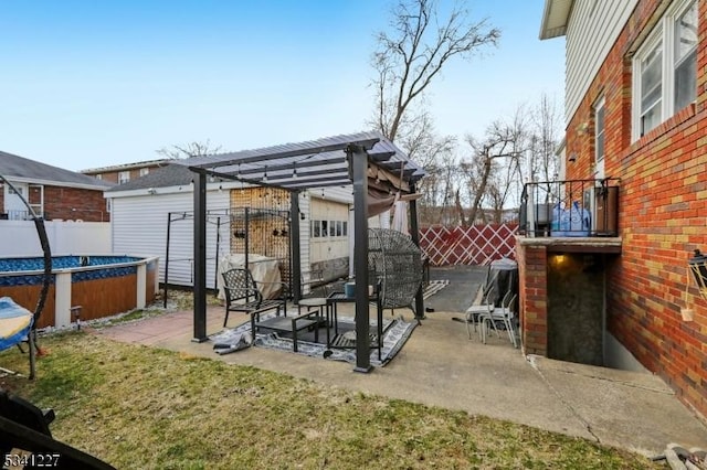 view of patio featuring a fenced in pool, fence, and a pergola