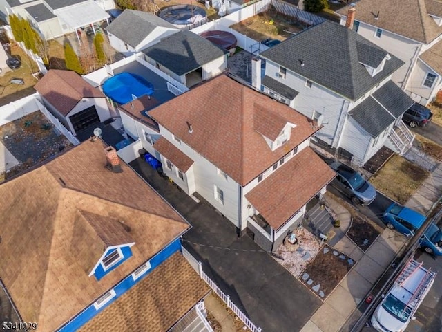 birds eye view of property with a residential view