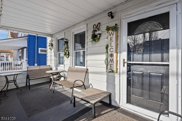 doorway to property with a porch