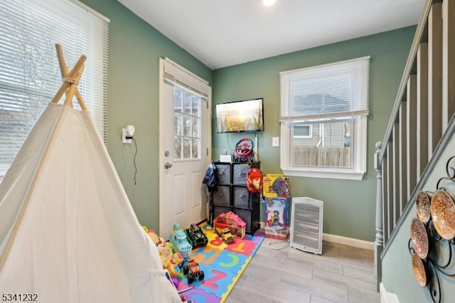 game room with baseboards