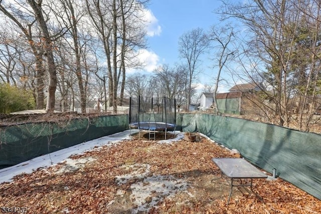 view of yard featuring a trampoline