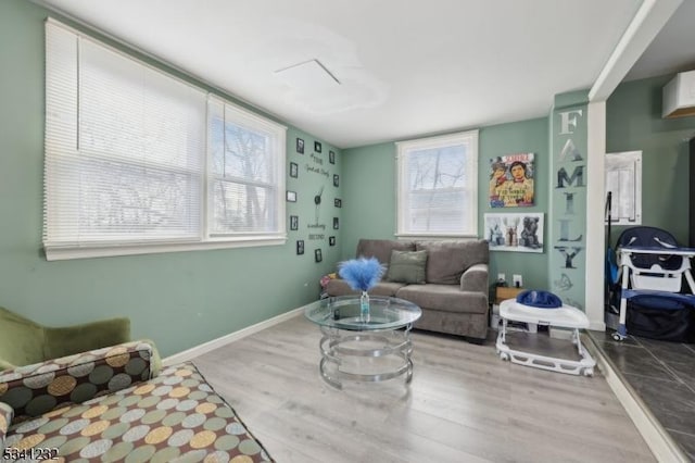 living room with wood finished floors and baseboards