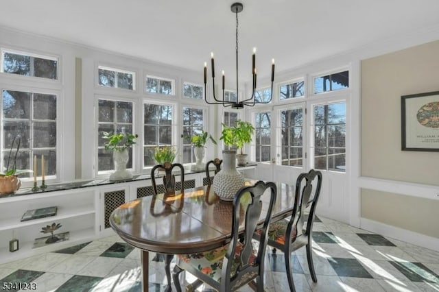 sunroom with an inviting chandelier