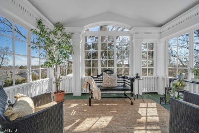 sunroom / solarium featuring lofted ceiling