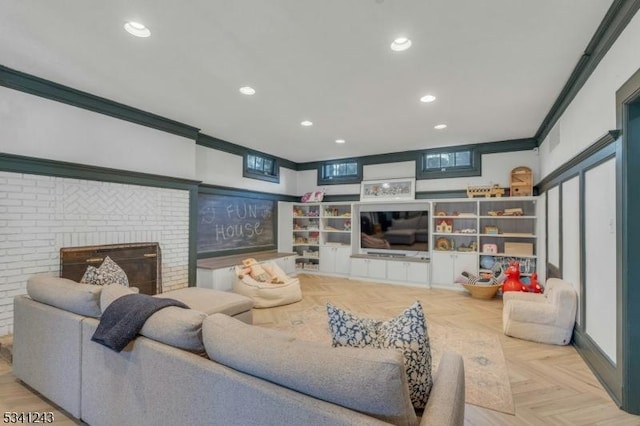 living room featuring recessed lighting, a fireplace, and ornamental molding