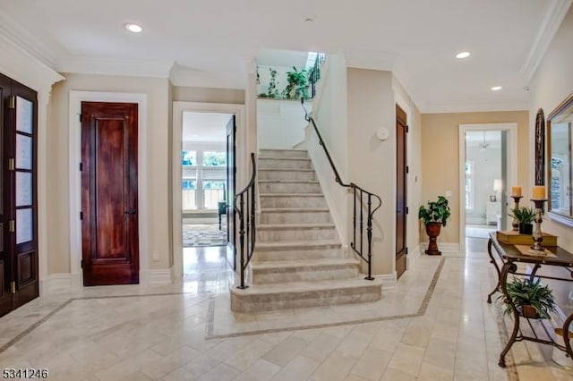 foyer entrance featuring ornamental molding, recessed lighting, stairway, and baseboards