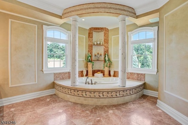 full bathroom featuring decorative columns, crown molding, baseboards, and a bath