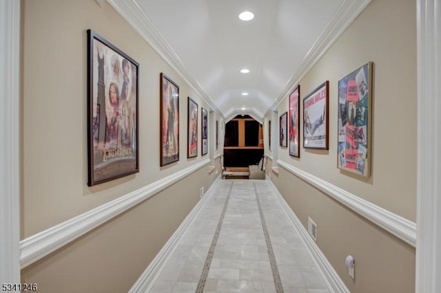 hall with baseboards, ornamental molding, visible vents, and recessed lighting