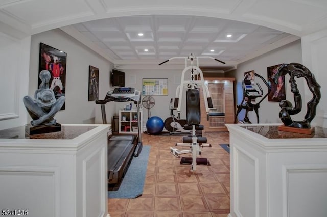 workout room with ornamental molding, recessed lighting, and coffered ceiling