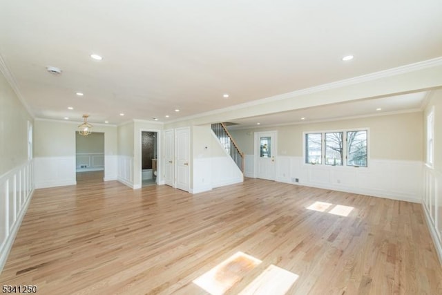 unfurnished living room featuring stairway, recessed lighting, and light wood-type flooring