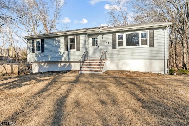 ranch-style home with fence