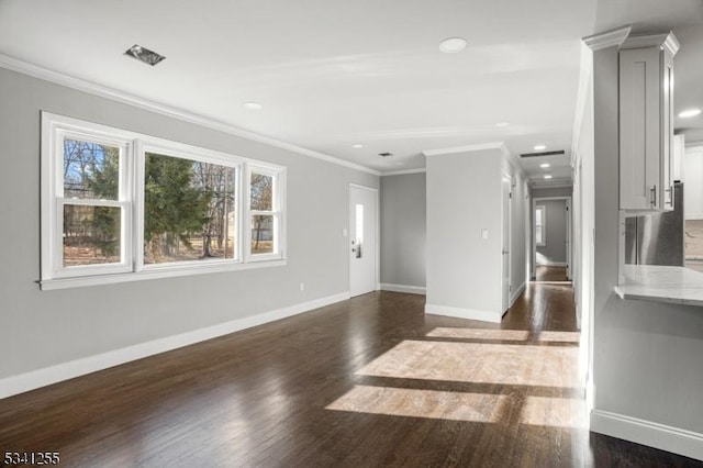 unfurnished living room featuring dark wood-style floors, baseboards, ornamental molding, and recessed lighting