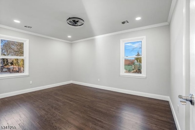 spare room featuring visible vents, baseboards, ornamental molding, dark wood-type flooring, and recessed lighting