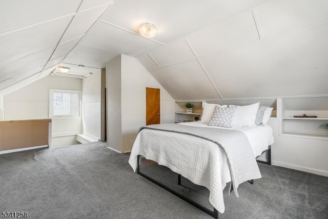 bedroom featuring lofted ceiling and carpet floors