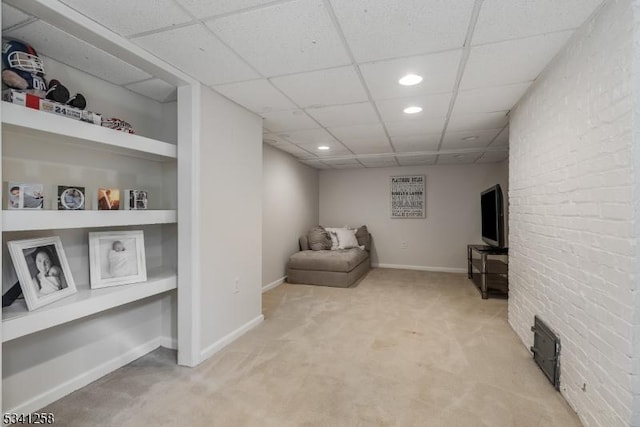 living area with light carpet, baseboards, a drop ceiling, and recessed lighting