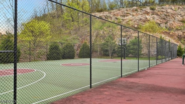 view of sport court with community basketball court and fence