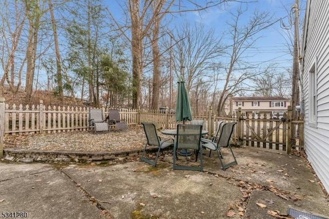 view of patio / terrace featuring outdoor dining area and a fenced backyard