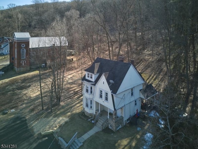 bird's eye view featuring a view of trees