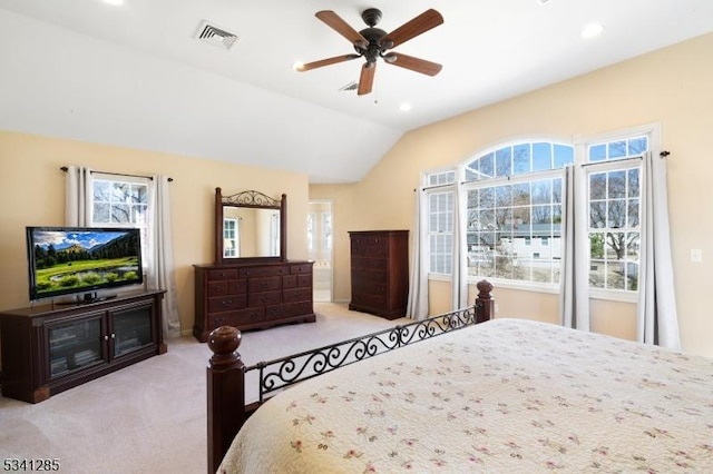 carpeted bedroom featuring lofted ceiling, multiple windows, recessed lighting, and visible vents