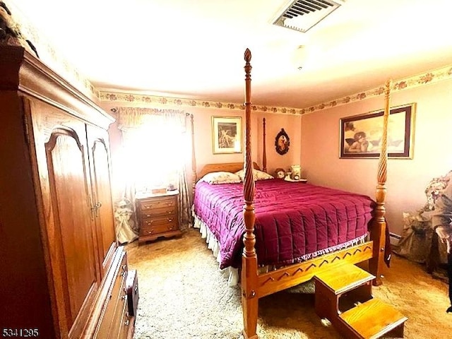 carpeted bedroom with visible vents