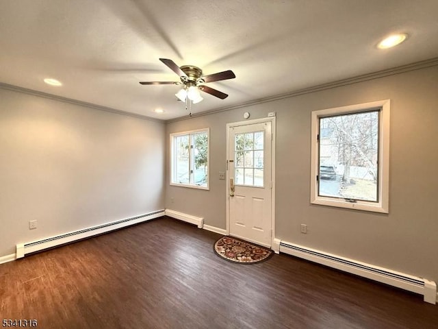 doorway with ornamental molding, baseboard heating, and dark wood-style flooring