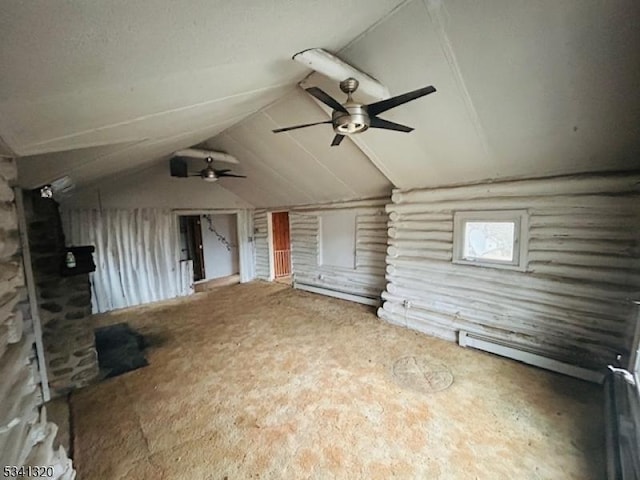 interior space featuring rustic walls and vaulted ceiling