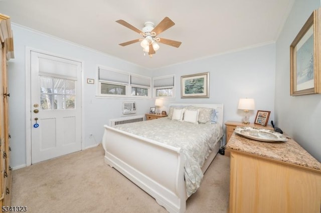 bedroom featuring radiator, ceiling fan, light carpet, and ornamental molding