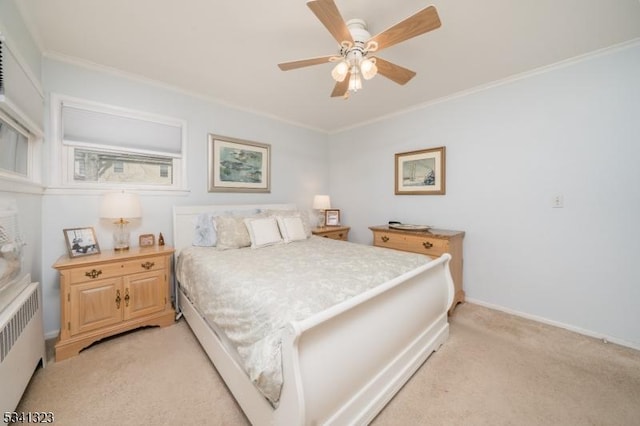 bedroom featuring baseboards, a ceiling fan, light colored carpet, radiator heating unit, and crown molding