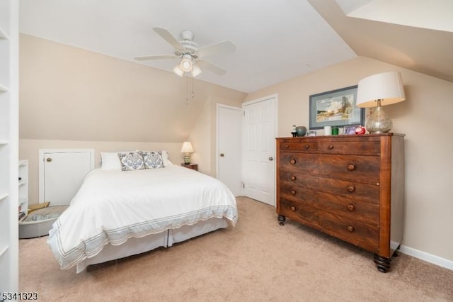 bedroom featuring light carpet, ceiling fan, vaulted ceiling, and baseboards