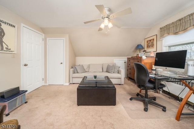 home office with carpet floors, lofted ceiling, and ceiling fan