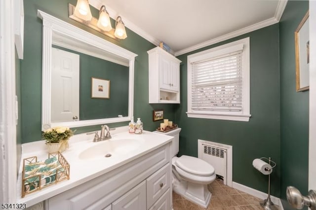 bathroom with ornamental molding, vanity, toilet, and radiator