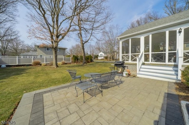 view of patio with entry steps, a sunroom, and fence