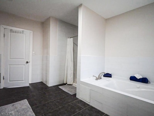 full bath with curtained shower, tile walls, and a bath