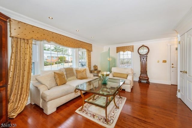 living room with baseboards, ornamental molding, wood finished floors, and recessed lighting