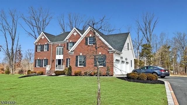 view of front of property featuring central air condition unit, a front lawn, aphalt driveway, and brick siding