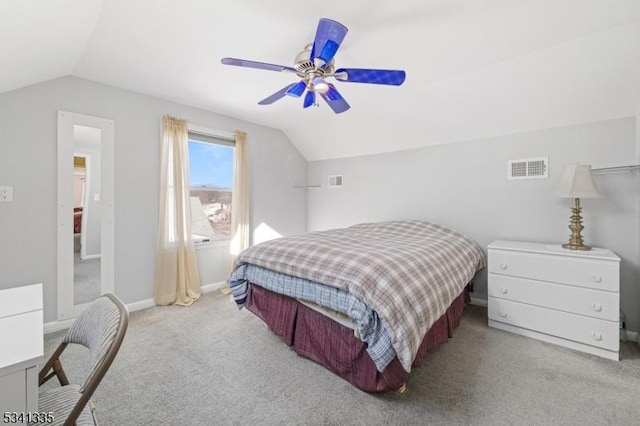 carpeted bedroom featuring lofted ceiling, visible vents, ceiling fan, and baseboards