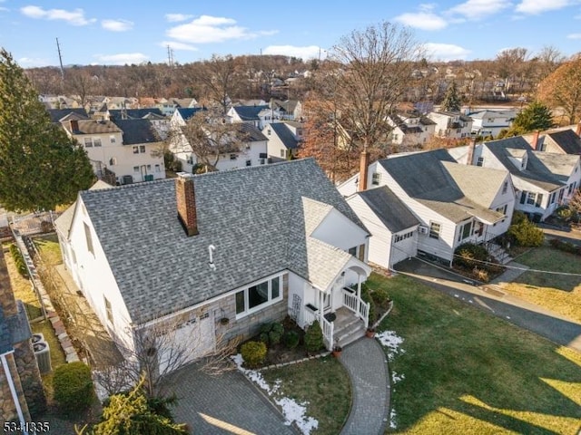 birds eye view of property with a residential view