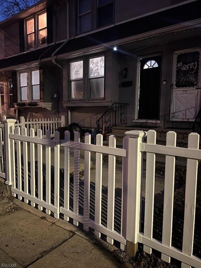 view of property with a fenced front yard