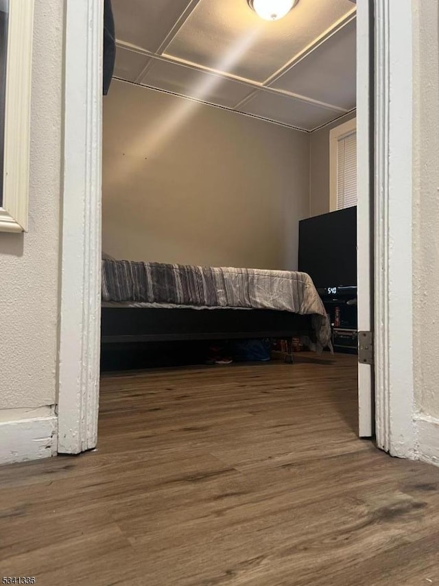 bedroom featuring wood finished floors