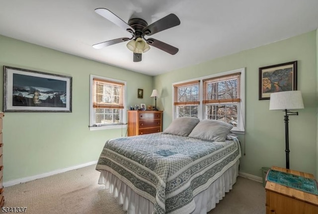 bedroom with carpet, baseboards, and ceiling fan