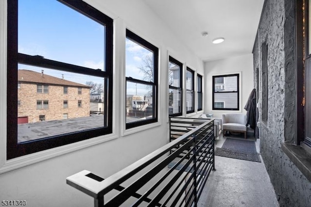 hallway with concrete floors